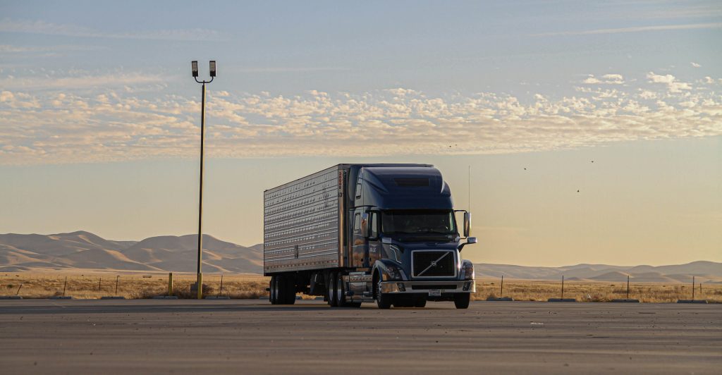 Enclosed semi-truck in empty parking lot